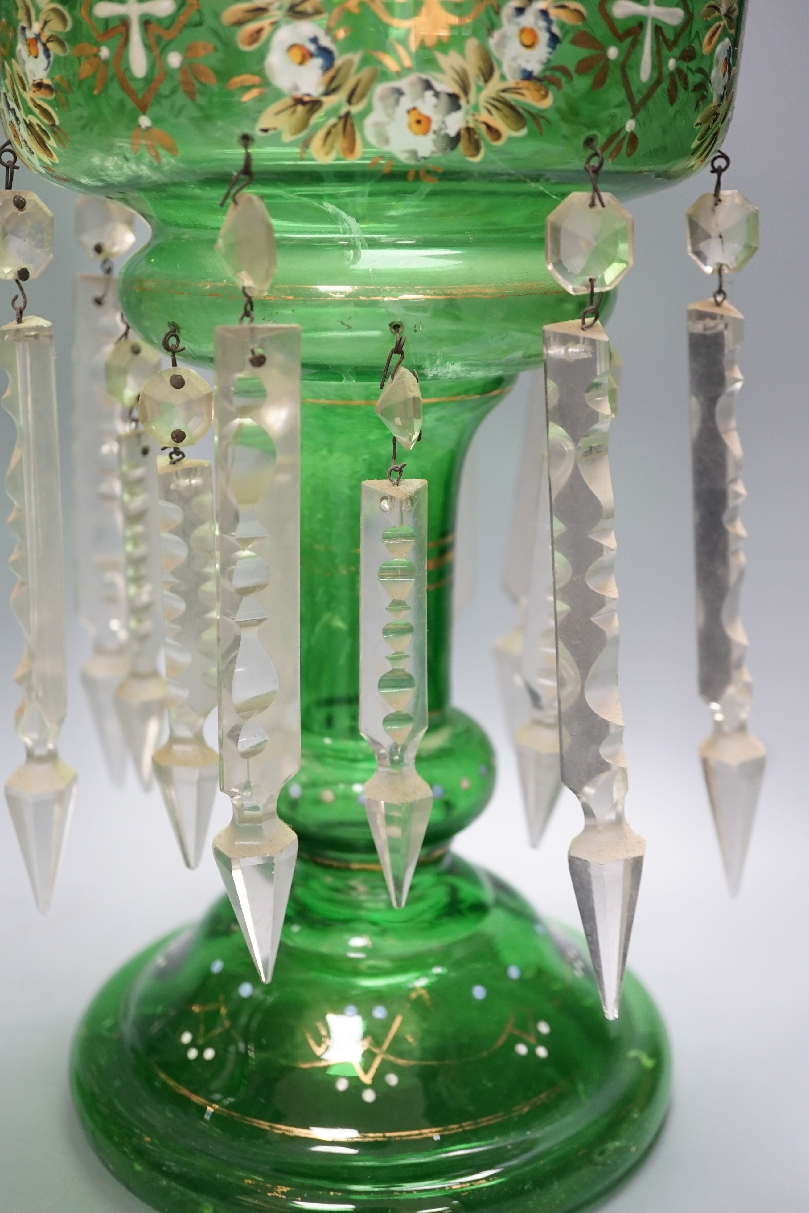 A pair of late 19th century green glass enamel lustres - 37cm high